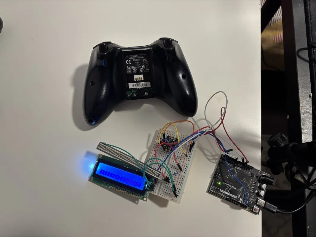 BlitzMind hardware prototype — Xbox 360 controller shell next to a breadboard mounting the PPG sensor, microcontroller, and LCD readout