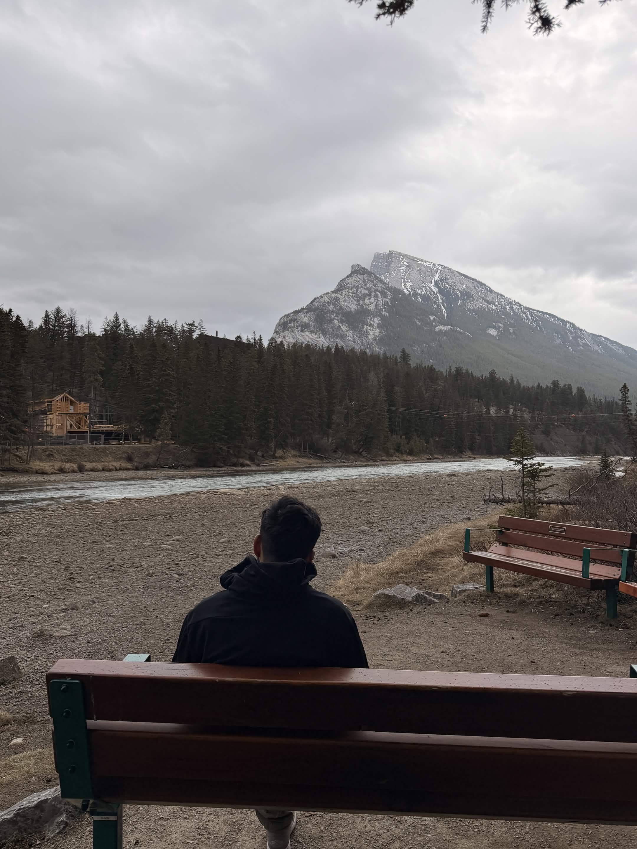 Dhruv looking out at the Bow River in Banff